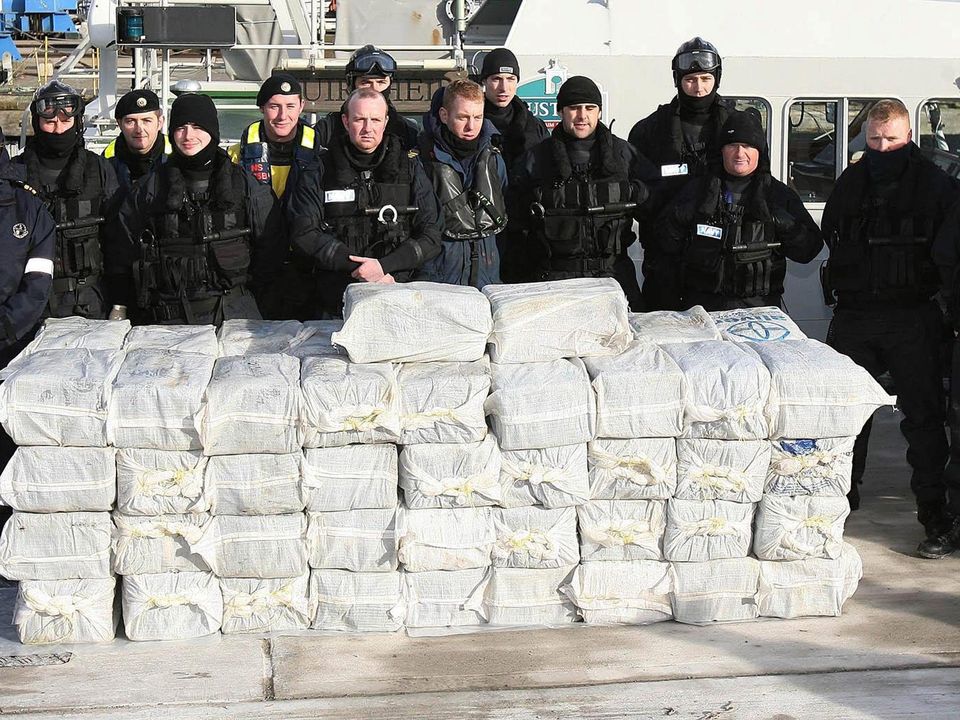 Armed Naval and Garda personnel with the half a billion euro of cocaine which was seized from a yacht off the west coast of Ireland